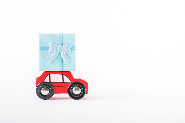 Toy car with gift on roof