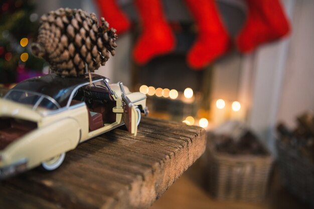 Toy car with a pinecone on top