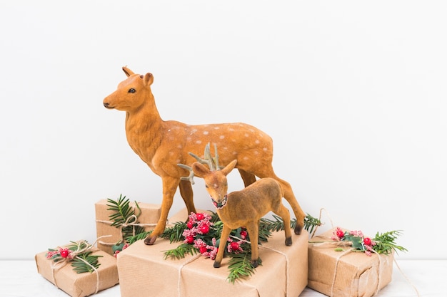 Toy deer on present boxes 