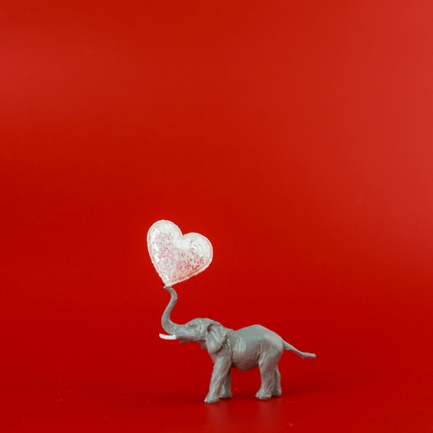 Toy grey elephant with heart 