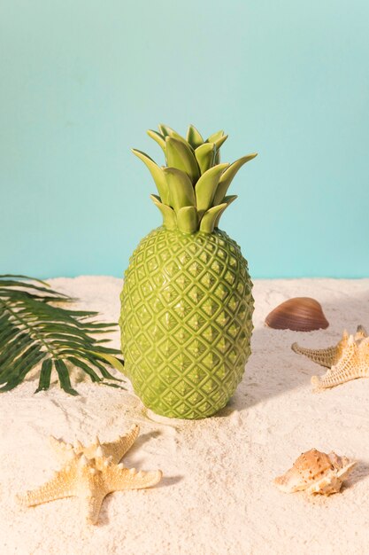 Toy pineapple on beach