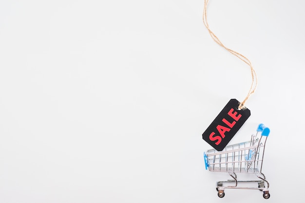 Toy supermarket cart with sale label