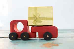 Free photo toy truck with a golden gift