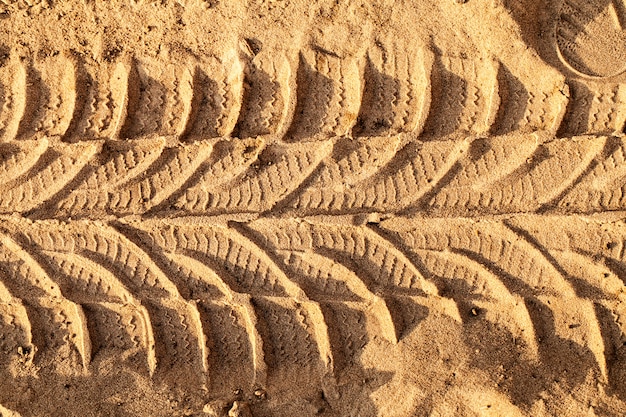 Trace of wheels on a sandy road 