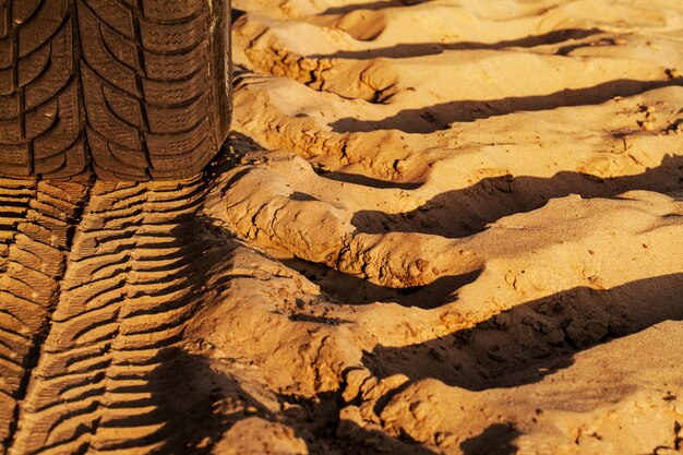 Trace of wheels on a sandy road 