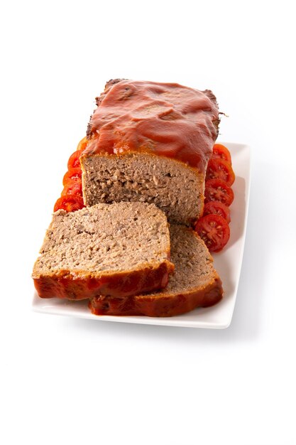 Traditional American meatloaf with ketchup isolated on white background.