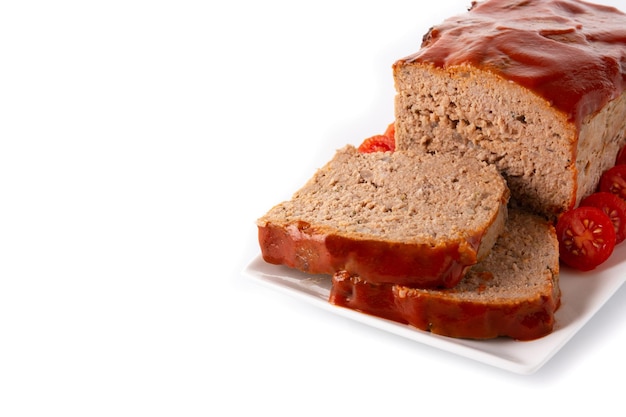 Traditional American meatloaf with ketcup isolated on white background