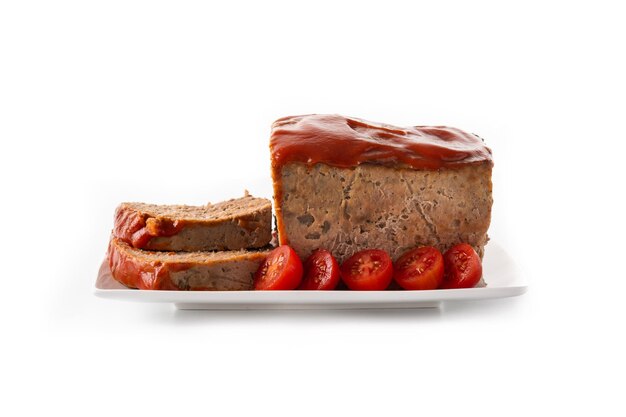 Traditional American meatloaf with ketcup isolated on white background