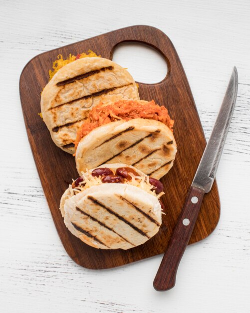 Traditional arepas on wooden board