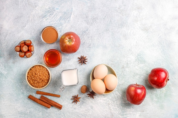 Traditional autumn baking ingredients: apples, cinnamon, nuts.