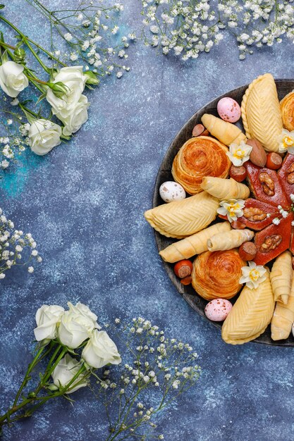 Traditional Azerbaijan holiday Novruz cookies baklavas and shakarburas on black tray plate 