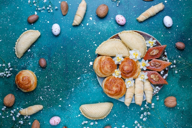 Traditional Azerbaijan holiday Novruz cookies baklavas and shakarburas on black tray plate 