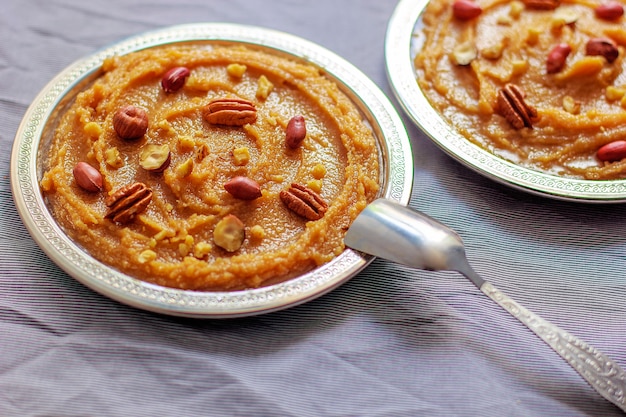 Free photo traditional azerbaijan, indian, turkish sweet dessert halvah with nuts on top