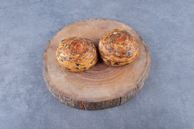 Free photo traditional azerbaijani cookie sweet gogals on a board , on the marble.