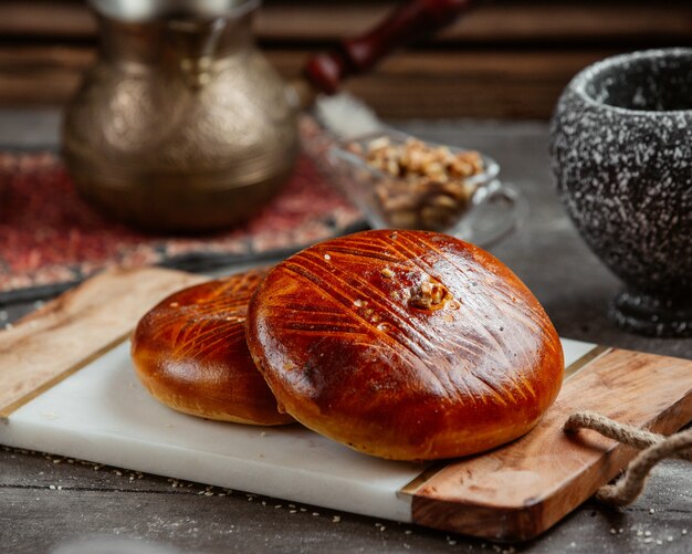 Traditional azerbaijani sweet bread garnished with walnut