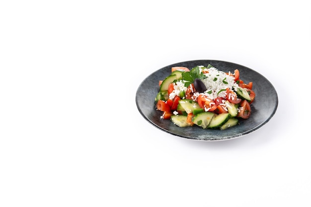 Traditional Bulgarian shopska salad with tomatocucumber and bulgarian sirene cheese isolated