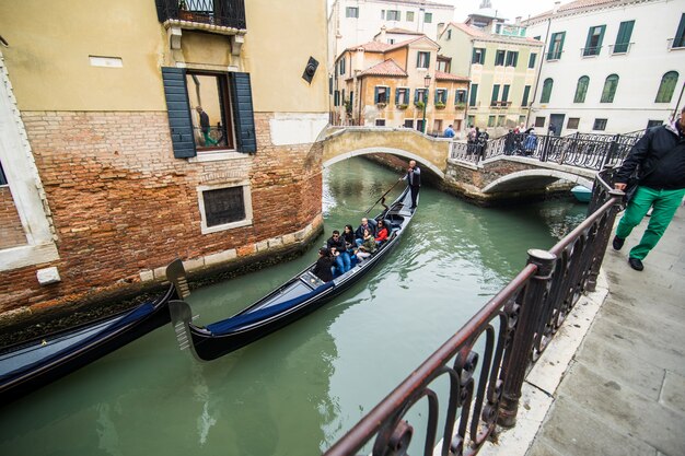 Traditional canal street with gondola in Venice city, Italy