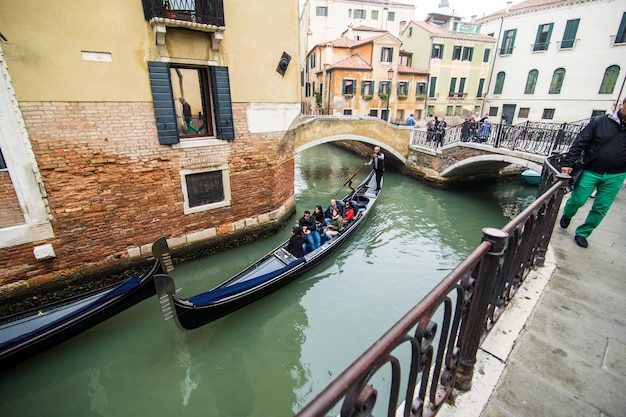 Traditional canal street with gondola in Venice city, Italy