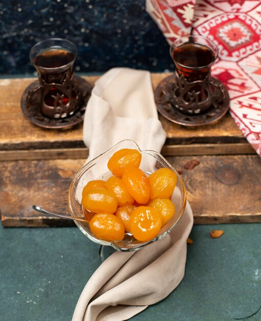 Traditional chestnut confiture with two glasses of tea