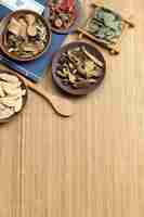 Free photo traditional chinese medicine on bamboo desk