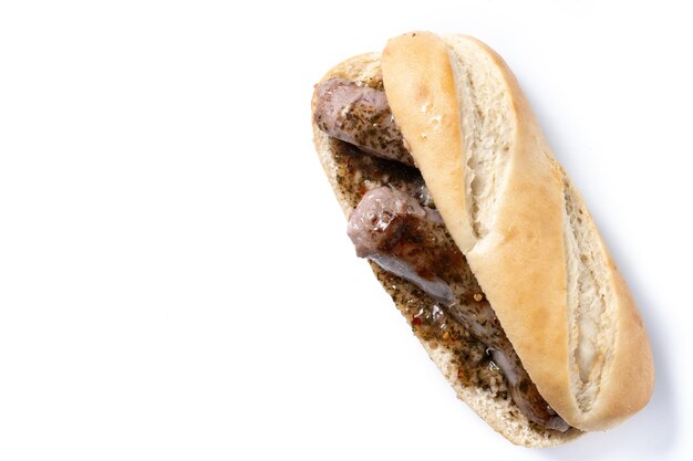 Traditional choripan Argentina sandwich with chorizo and chimichurri sauce isolated on white backg