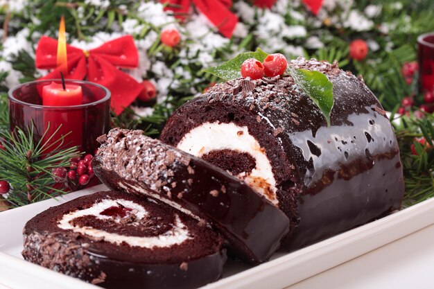 traditional french buche de noel christmas cake in a french patisserie  Stock Illustration