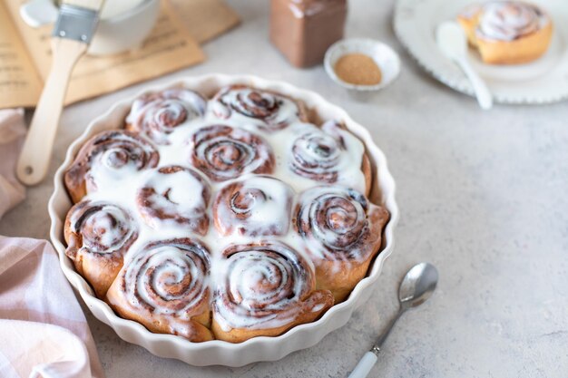 Traditional cinnamon buns on a white table homemade sweet buns