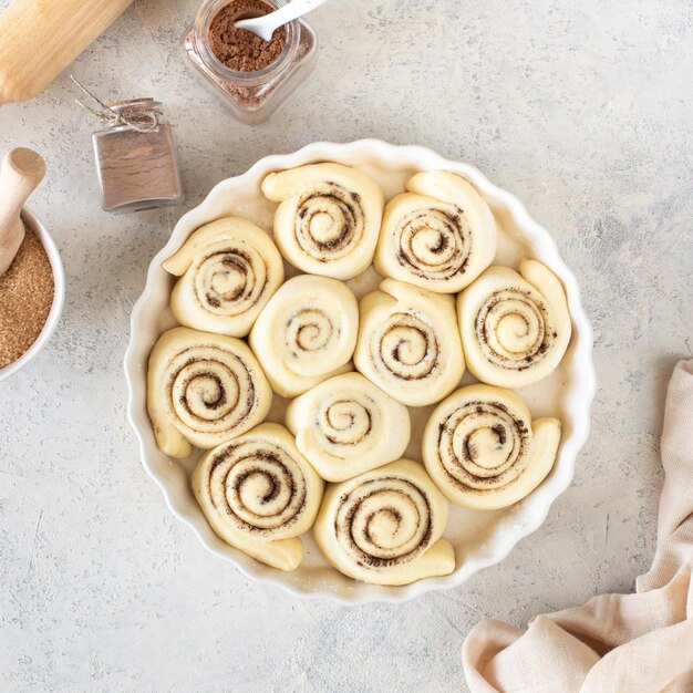 Traditional cinnamon rolls dough preparation homemade sweet rolls Square