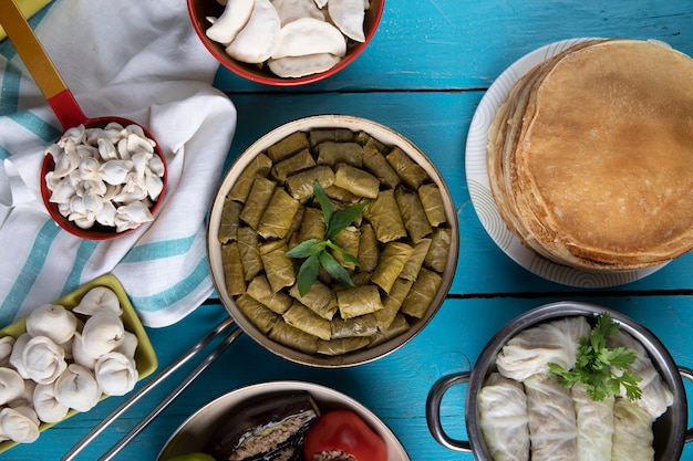 Free photo traditional dolma types with khingal and crepes.