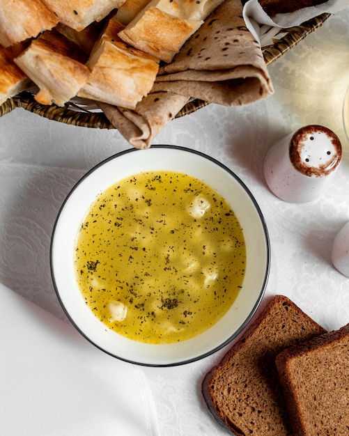 traditional dushbar on broth sprinkled with dried mint