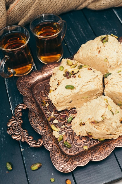 Free photo traditional eastern desserts on wooden background