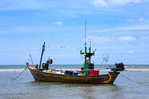 Free photo traditional fishing boat by the beach