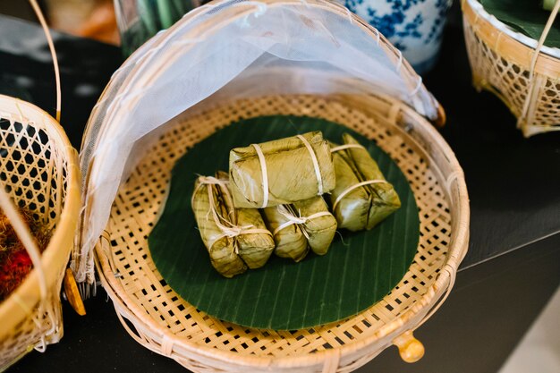 traditional food snack dessert with sticky rice and banana in Thailand