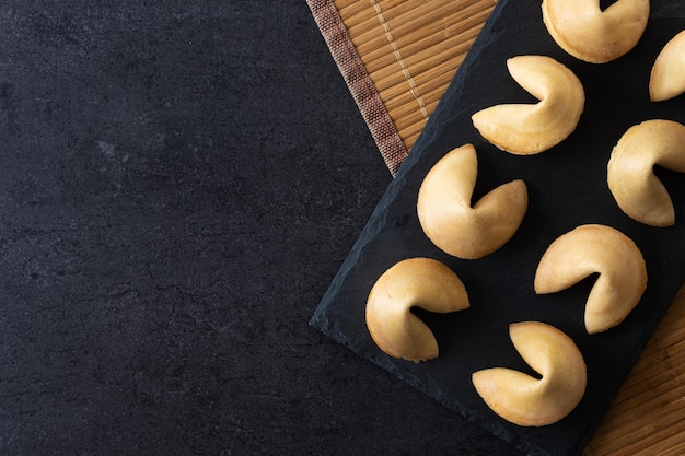 Traditional fortune cookies black slate backgroundxA