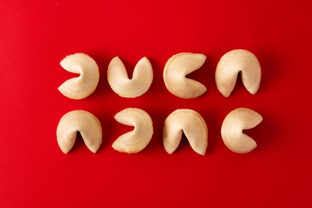 Free photo traditional fortune cookies on red background