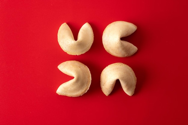 Free photo traditional fortune cookies on red background