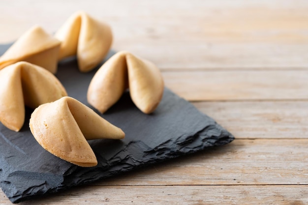 Traditional fortune cookies on wooden tablexA