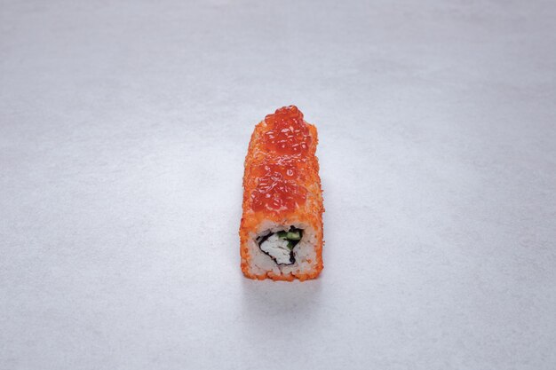 Traditional fresh sushi rolls on white background.