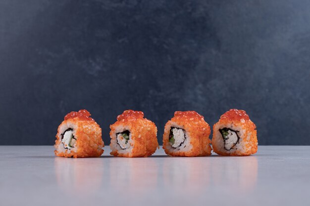 Traditional fresh sushi rolls on white background. 