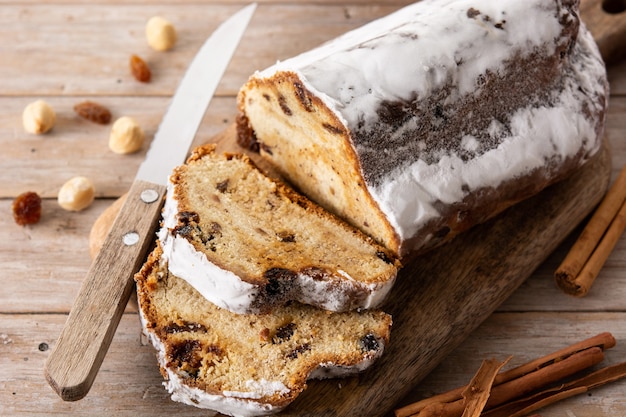 Traditional German Christmas stollen on wooden table