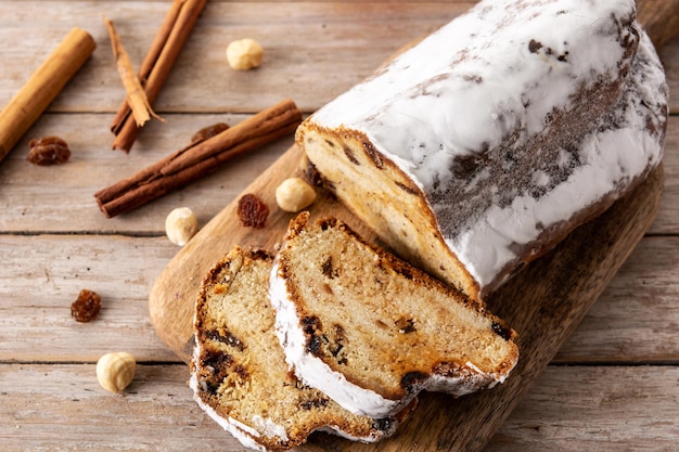 Traditional German Christmas stollen on wooden table