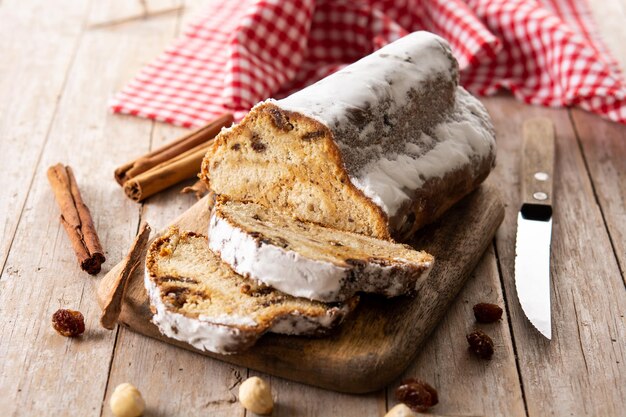Traditional German Christmas stollen on wooden table