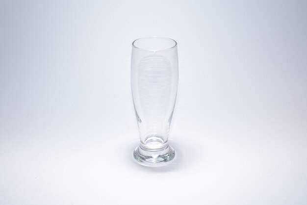 Traditional glass cup over white surface