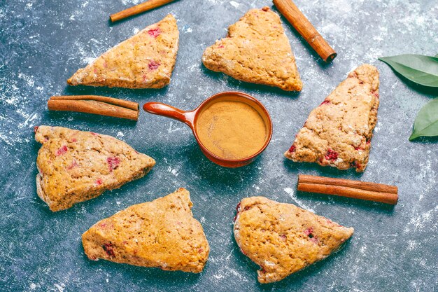 Traditional homemade English scones with frozen raspberries and cinnamon,