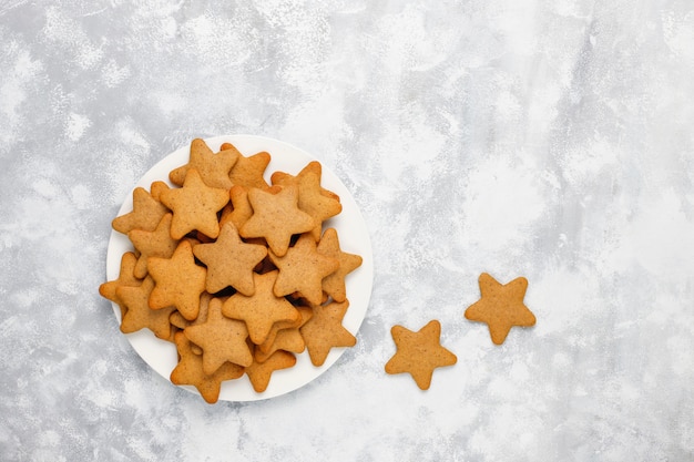 Traditional homemade gingerbread cookies on grey concrete  ,close up,Christmas ,top view,flat lay