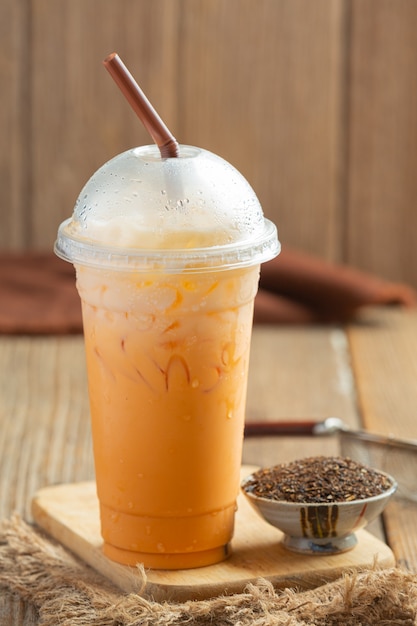 Free photo traditional iced milk tea and red tea powder.