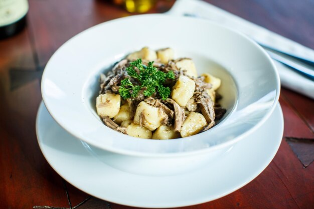 Traditional Italian dishes gnocchi with duck