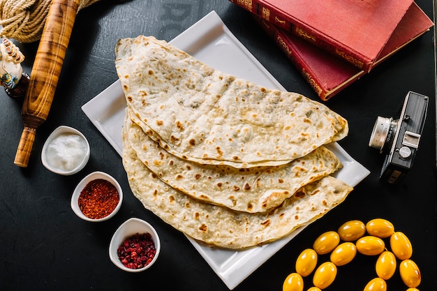 Traditional meat kutab with sumakh rasberry plain youghurt top view