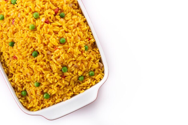 Traditional Mexican rice served with green peas isolated on white background