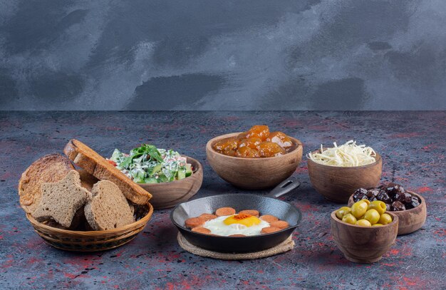 Traditional rich breakfast table with variety of foods. 